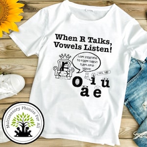 May include: White t-shirt with the text "When R Talks, Vowels Listen!" and cartoon illustrations of letters and a speech bubble. The shirt also features a logo that says "Multisensory Phonics For All".