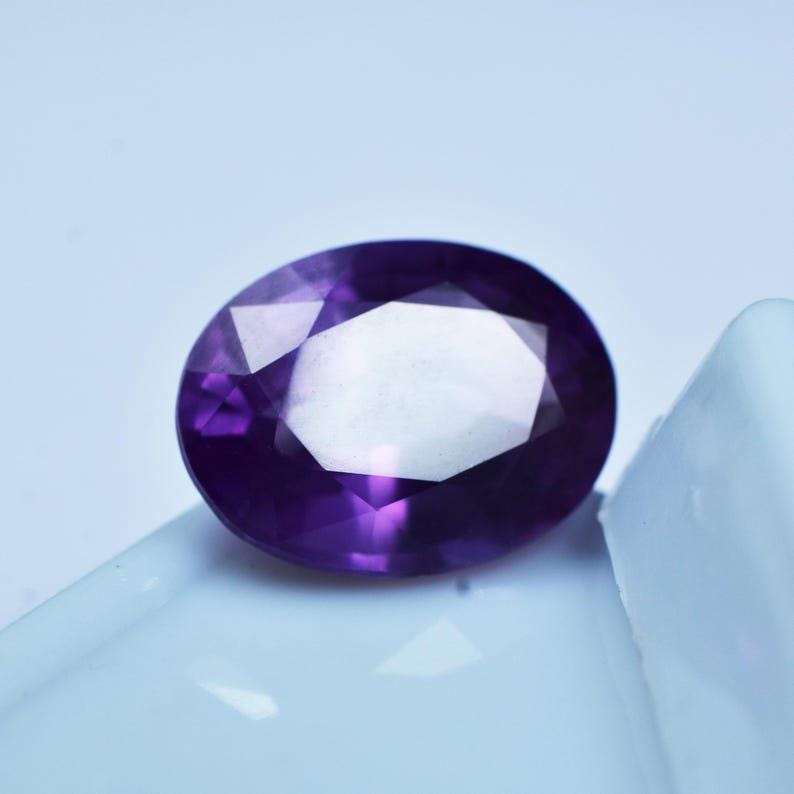 "8-9 carat purple sapphire in oval cut, premium quality loose stone for earrings or pendant settings"