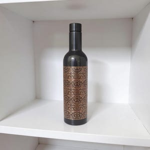 Eco conscious copper water bottle with natural finish, perfect for Ayurvedic health benefits and zero waste lifestyle.