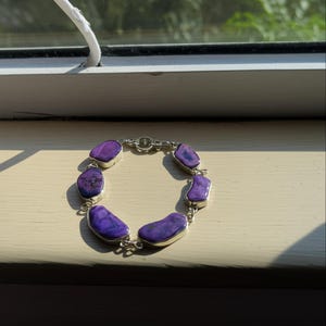 Amethyst crystal jewelry representing peace and calm energy