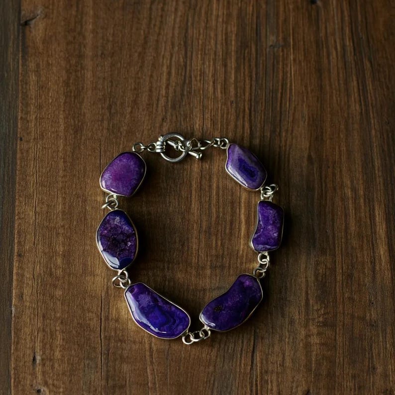 Amethyst gemstone bracelet with silver link design