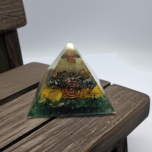 Meditation orgone energy pyramid on marble surface