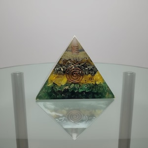 Orgone energy pyramid with gemstones for EMF protection