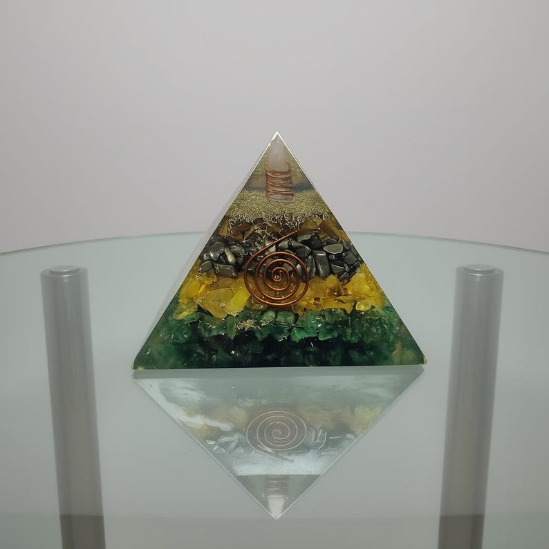 Orgone energy pyramid with gemstones for EMF protection