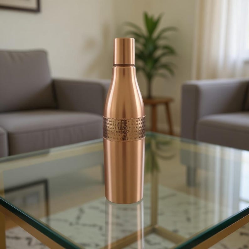 Hammered copper water bottle 1 liter capacity, sustainable zero waste drinkware for office desk, travel, and home use.