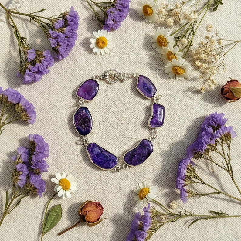 Handmade Amethyst purple gemstone bracelet on white background