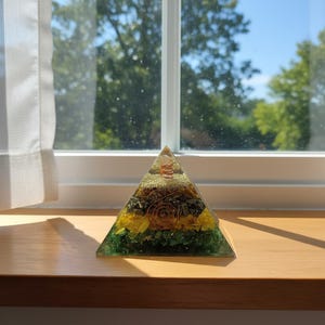 Handmade orgone pyramid with copper coil and crystal layers
