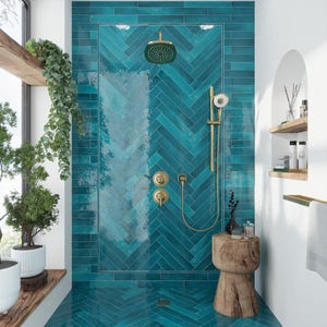May include: A teal blue bathroom with a shower stall featuring a herringbone tile pattern. The shower head and fixtures are gold. A wooden stool sits in the corner of the bathroom.