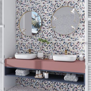 May include: A bathroom vanity with two sinks and a pink countertop. The backsplash is a mosaic of colorful circles. Two round mirrors with gold frames hang above the sinks.