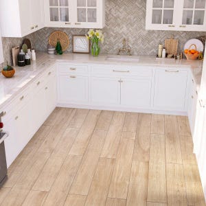 May include: A white kitchen with white cabinets and a white countertop. The countertop has a light brown wood-look tile floor. The backsplash is a light brown herringbone pattern.