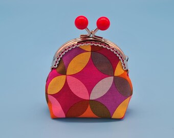 Small clip wallet made of colorful patterned cotton and taffeta with metal frame
