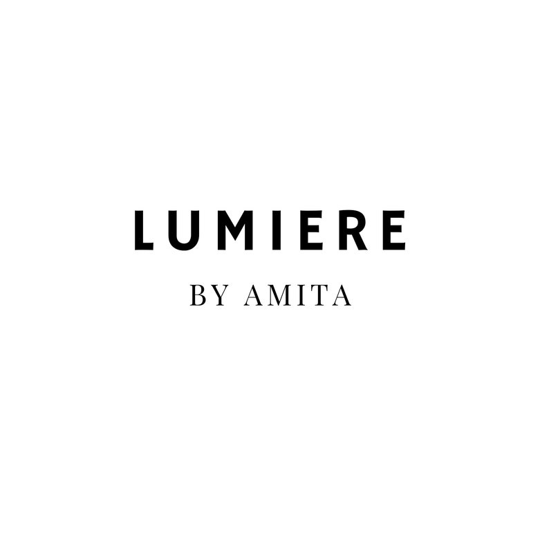 May include: Black and white logo for Lumiere by Amita.