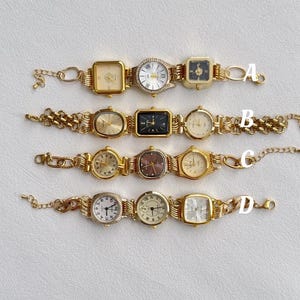 May include: Four gold-tone wristwatches with different face designs and gold-tone chain link bands. The watches are arranged in a row from top to bottom, labeled A through D.