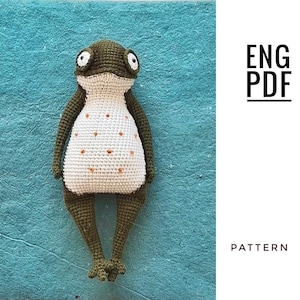 Puede incluir: Patrón de crochet para un juguete amigurumi de rana verde con detalles blancos y naranjas. El patrón está disponible en inglés y es una descarga PDF. ENG PDF PATTERN