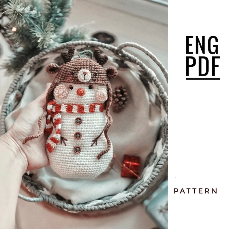 May include: Crochet amigurumi pattern for a snowman wearing a reindeer hat and scarf. The pattern is available in English and is in PDF format.