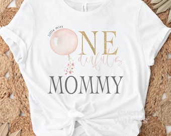 May include: White t-shirt with a pink balloon, gold glitter text that says "One Derful Mommy" and the words "little miss" above the balloon.