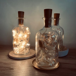 Dried flowers in a glass with fairy lights