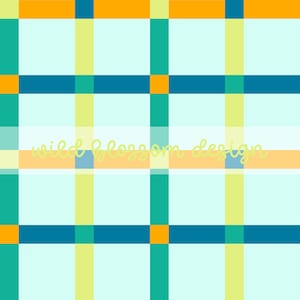 May include: A light blue plaid pattern with teal, orange, and yellow intersecting lines. The text "wild blossom design" is written in a light yellow cursive font across the center of the image.