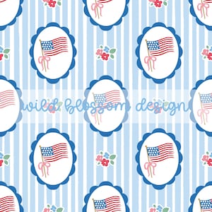 May include: A repeating pattern featuring the American flag within a blue scalloped oval frame, set against a light blue and white striped background. Small floral clusters and the text "wild blossom design" are also present.
