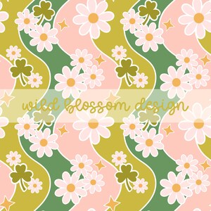 May include: A repeating pattern featuring white daisies, green shamrocks, and gold stars on a wavy background of olive green and pink. The text "wild blossom design" is in gold script across the image. This design is suitable for fabric or wallpaper.