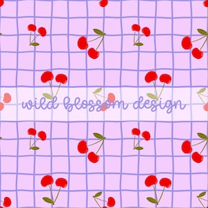 May include: A seamless pattern featuring red cherries with green stems and leaves on a light purple background with a grid pattern. The text "wild blossom design" is written in white on a light blue banner.