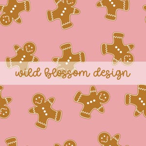 May include: A repeating pattern of gingerbread men on a pink background. The gingerbread men are brown with white accents and smiling faces. The text "wild blossom design" is displayed across the image.
