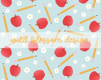 May include: A seamless pattern featuring red apples, yellow pencils, and white flowers on a light blue background. The text "wild blossom design" is written in yellow across the middle of the pattern.