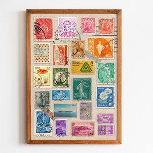 May include: A framed collage of vintage postage stamps in various colors and designs, including flowers, landscapes, and portraits. The frame is brown wood and the stamps are arranged in a rainbow pattern.