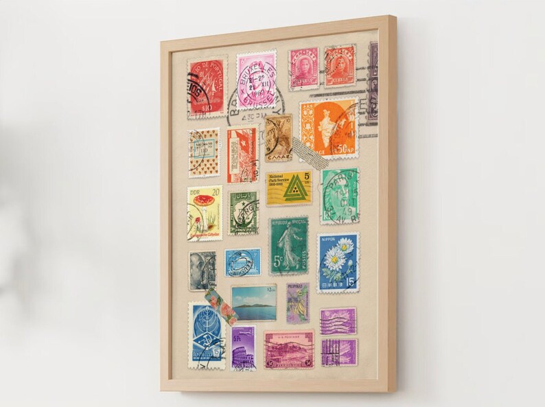 May include: A framed collage of vintage postage stamps from around the world. The stamps are arranged in a grid pattern and feature a variety of colors, designs, and subjects. The frame is made of wood and has a natural finish.