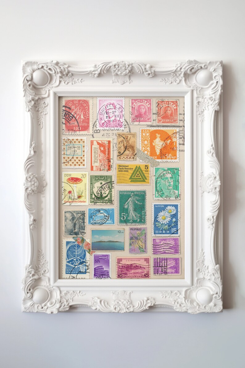 May include: A white frame with a collage of vintage postage stamps from around the world. The stamps are arranged in a grid pattern and feature a variety of designs, including flowers, animals, and landscapes. The frame is decorated with ornate details and has a white background.