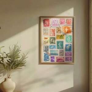 May include: A framed collage of vintage postage stamps from around the world. The stamps are arranged in a grid pattern and feature a variety of colors, designs, and subjects. The frame is made of wood and has a light brown finish.