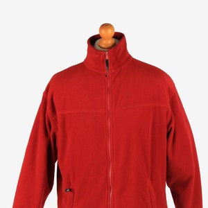 May include: A red fleece jacket with a zipper closure and a stand-up collar.