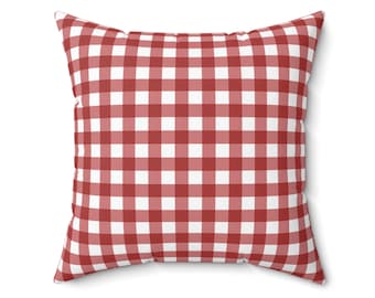 May include: Red and white gingham throw pillow. The pillow is square and has a soft, plush texture.