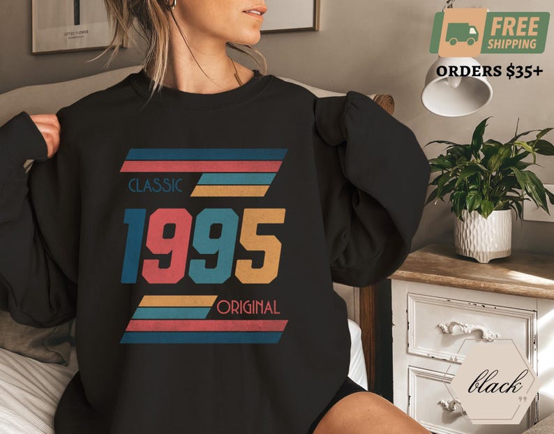 May include: Black sweatshirt with a vintage-style graphic design featuring the year 1995 with the words "Classic" and "Original" in colorful stripes.