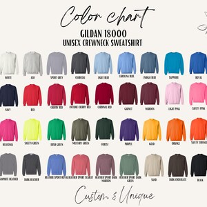May include: Color chart of Gildan 18000 unisex crewneck sweatshirts in various colors, including white, ash, sport grey, charcoal, light blue, Carolina blue, indigo blue, sapphire, royal, navy, red, cherry red, and more. The text "Custom & Unique" is also visible.