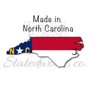 May include: A graphic of the North Carolina state outline, colored with the state flag design. The text "Made in North Carolina" is above the outline. The bottom of the image has the text "Statedwoods co."