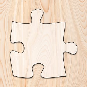 May include: A single wooden puzzle piece with a black outline. The piece is light brown with a wood grain pattern. The puzzle piece is a classic shape, with four distinct protrusions and indentations.