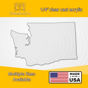 May include: A clear acrylic cutout of the state of Washington, 1/4 inch thick. The outline of the state is shown in grey. The image includes the text "1/4" clear cast acrylic", "Multiple Sizes Available", and "MADE IN THE USA".