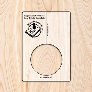 May include: A light-colored wooden cornhole board hole template. The template includes a 6-inch diameter circle, a center line, and text that reads "Regulation Cornhole Board Hole Template" and "Statedwoods Supply".