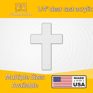 May include: A white cross made of 1/4 inch clear cast acrylic. The cross is on a white background with concentric circles. The text "Multiple Sizes Available" is at the bottom of the image. The text "MADE IN THE USA" is in a red, white, and blue star-shaped banner.