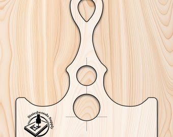 May include: A wooden template for creating a decorative wooden handle with two holes. The template is shaped like a stylized letter "T" with a loop at the top. The template is marked with a center line and a circle for the handle.