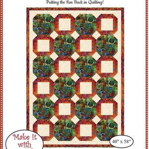May include: A colorful quilt pattern with a repeating geometric design. The quilt features squares and octagons in shades of red, green, and blue, with a cream-colored background. The dimensions are 40" x 58". The text reads "Fabric Cafe" and "Make it with 3 yards".