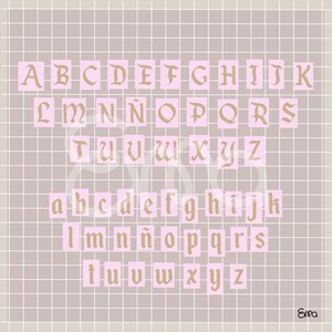 May include: A complete alphabet in uppercase and lowercase, displayed on a grid background. The letters are in a vintage serif font, with a gold color, set against a pink background. The background is a light gray grid.