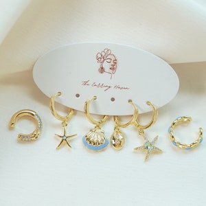 Pendientes de concha marina, pendientes con puños de oreja, juego de pendientes de aro dorado, pendientes de cauri, pendientes de aro de caracol, pila de pendientes, joyería hecha a mano, delicados