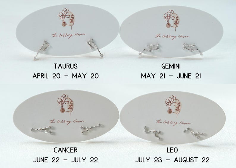 May include: Four sets of silver stud earrings on white oval cards. Each card has a line drawing of a woman's face and the text "The Calling Haven." The cards are labelled with zodiac signs: Taurus, Gemini, Cancer, and Leo, with their dates.