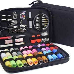May include: Black sewing kit with various tools and colorful thread spools. The kit includes scissors, needles, thimbles, a measuring tape, and thread in a range of colors. The kit is zippered and has a handle for easy carrying.