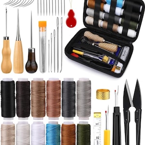 May include: A sewing kit with various tools and supplies. Includes needles, thread spools in multiple colors, a black zippered case, scissors, a thimble, a seam ripper, and a measuring tape. The thread colors range from black to white and blue.