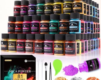 May include: A collection of 81 colors of mica powder in small jars with black lids, along with tools and samples of the powder. The box reads "MICA POWDER 81 COLORS". Various colors are visible, including gold, red, and green.