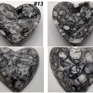 May include: Four heart-shaped decorative bowls. Each bowl is made of a gray and white stone with a unique marbled pattern. The bowls are labeled with the numbers #13 and #14.
