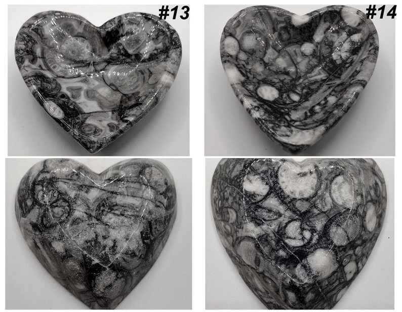 May include: Four heart-shaped decorative bowls. Each bowl is made of a gray and white stone with a unique marbled pattern. The bowls are labeled with the numbers #13 and #14.